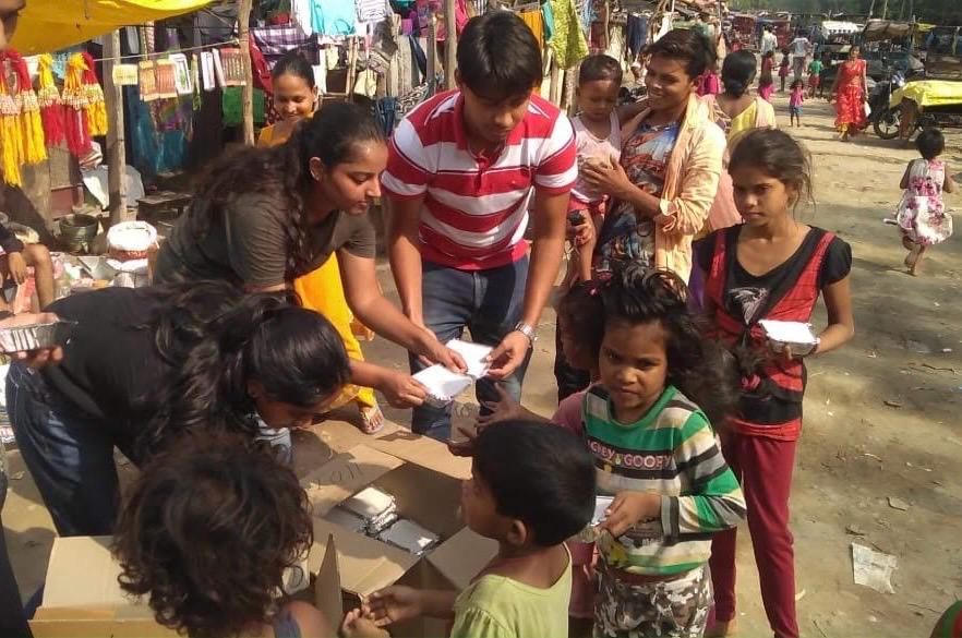 Distributing meals to children with Robin Hood Army
